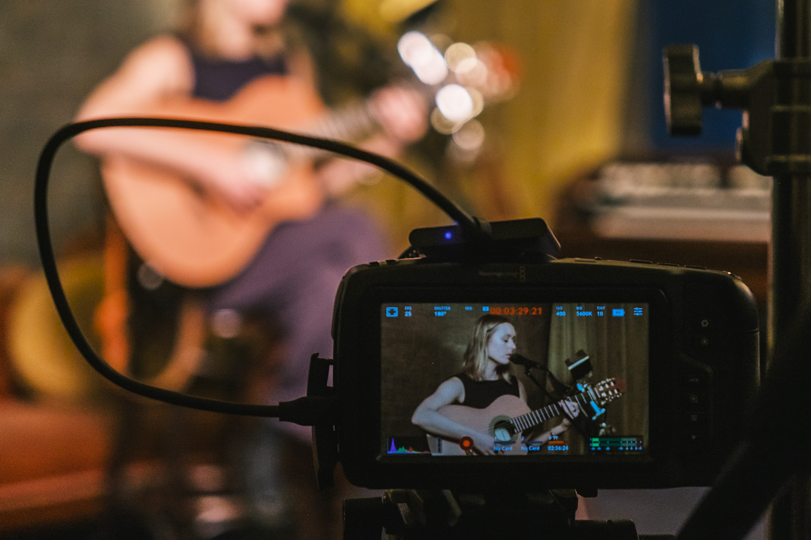 Behind the scenes: an artist filmed performing at a Stage and Storytelling shoot